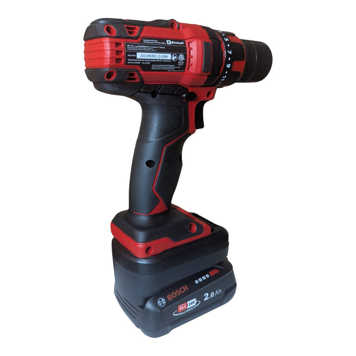 Bosch 18V PBA (Green) to Einhell 18V PXC battery adapter - installed on a cordless drill, tool rating plate in view