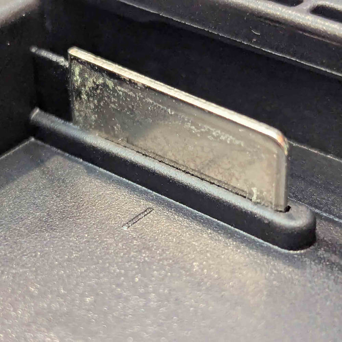 Makita 18V LXT to Einhell 18V PXC battery adapter - Makita battery-side terminal blade, close-up in its channel